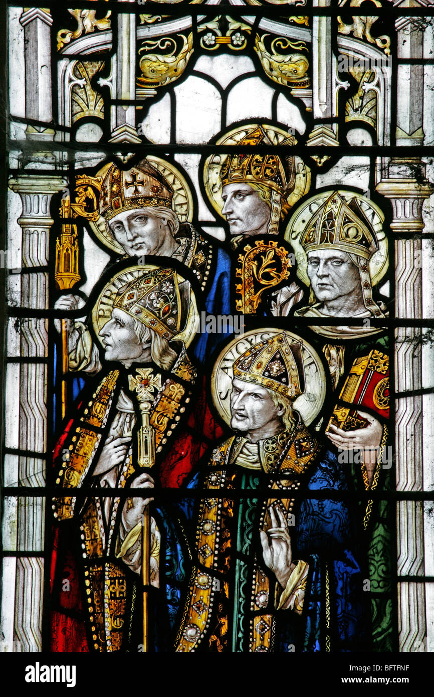 Detail of a stained glass window depicting Saints Augustine Birinius, Paulinus, Osmund and one other saint Stock Photo