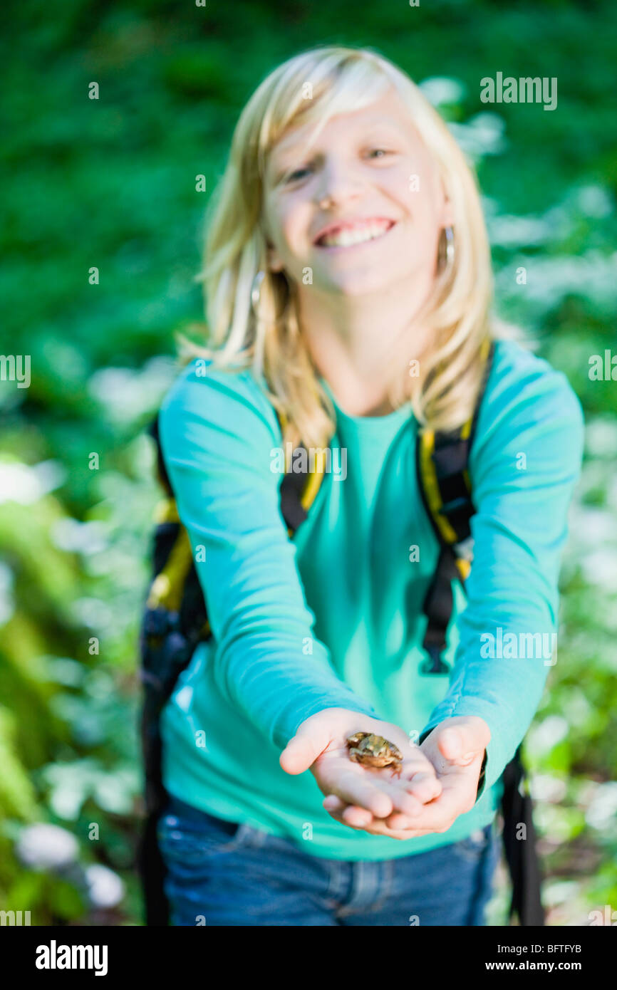 girl with a little frog Stock Photo Alamy