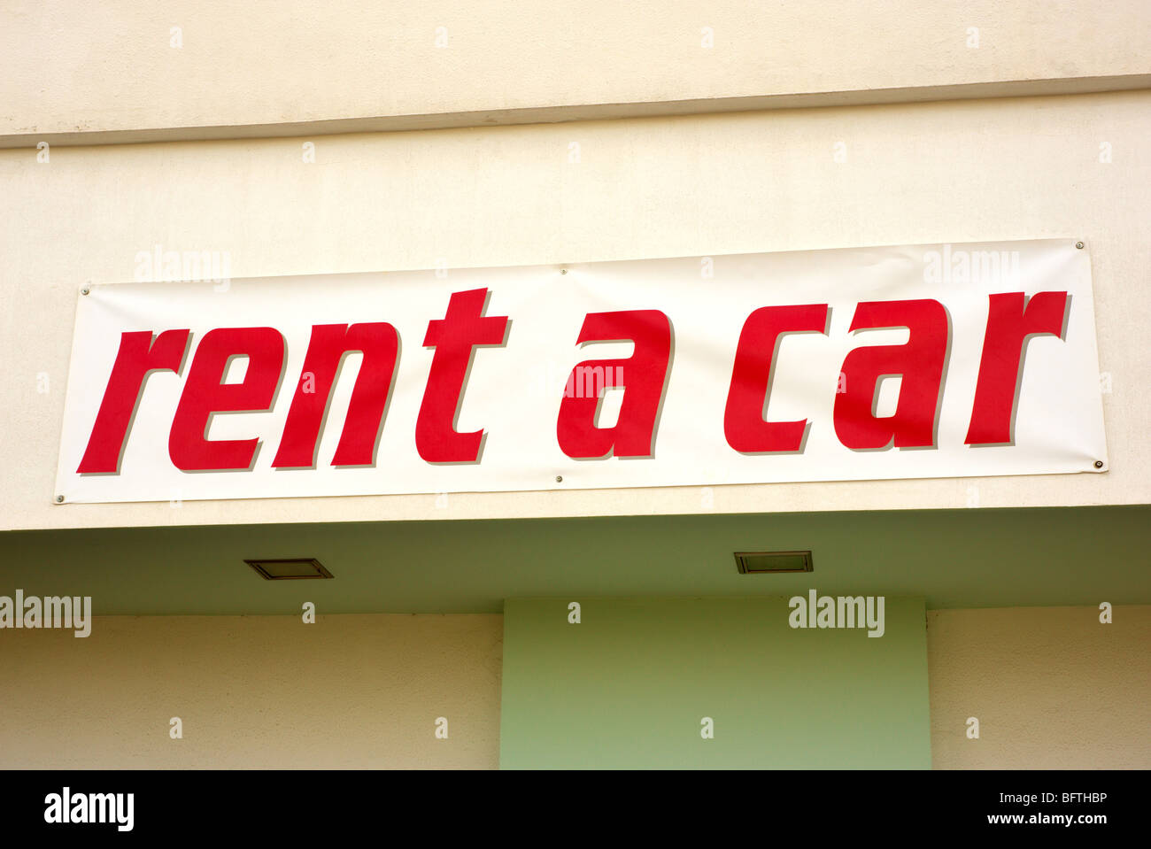 Red on white rent a car sign Stock Photo
