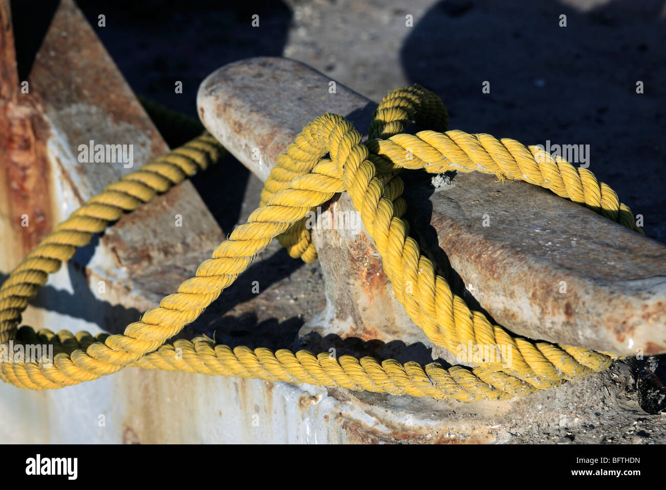 Yellow rope secures boat in port, Long Island, NY Stock Photo