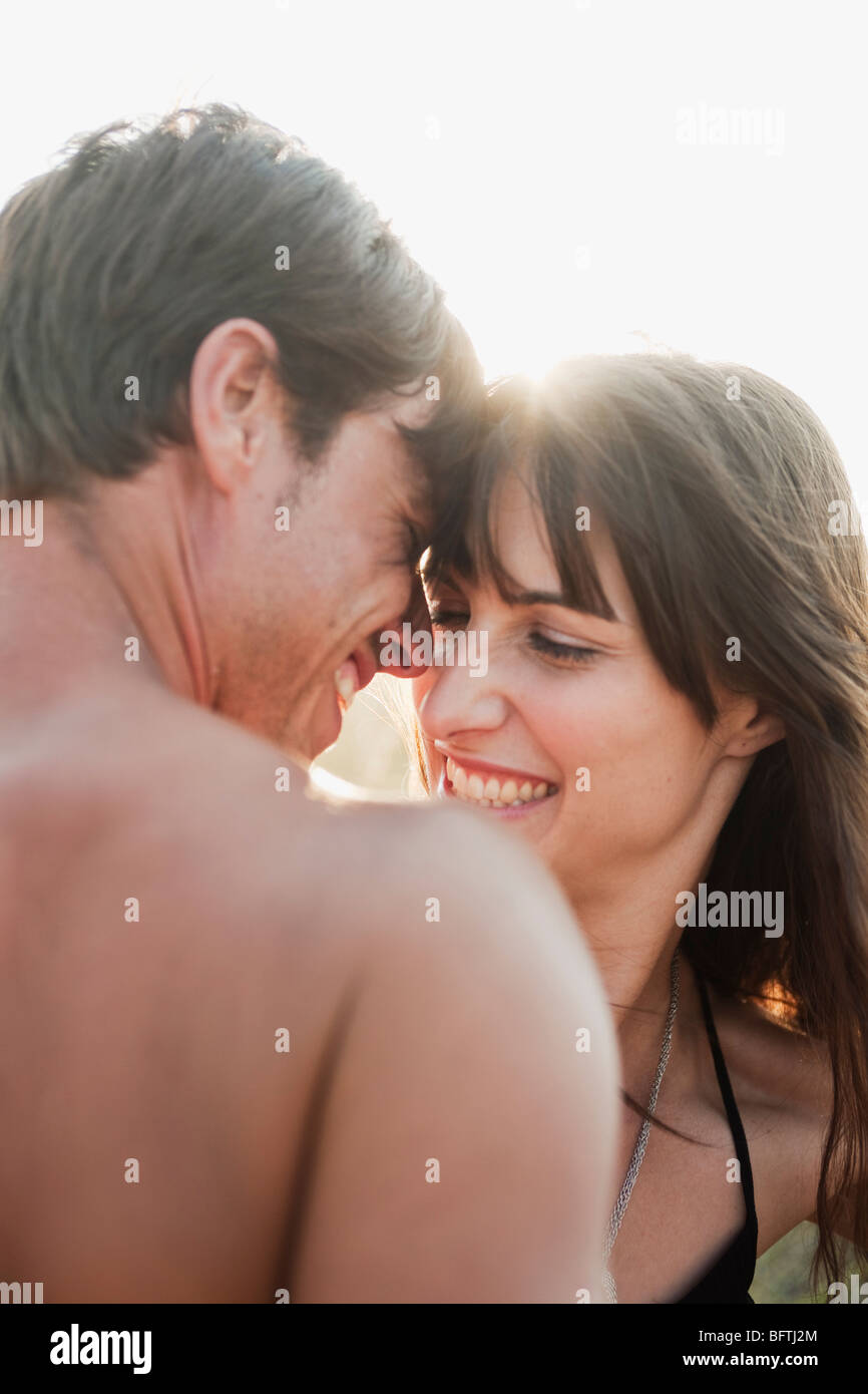 couple smiling and embracing Stock Photo