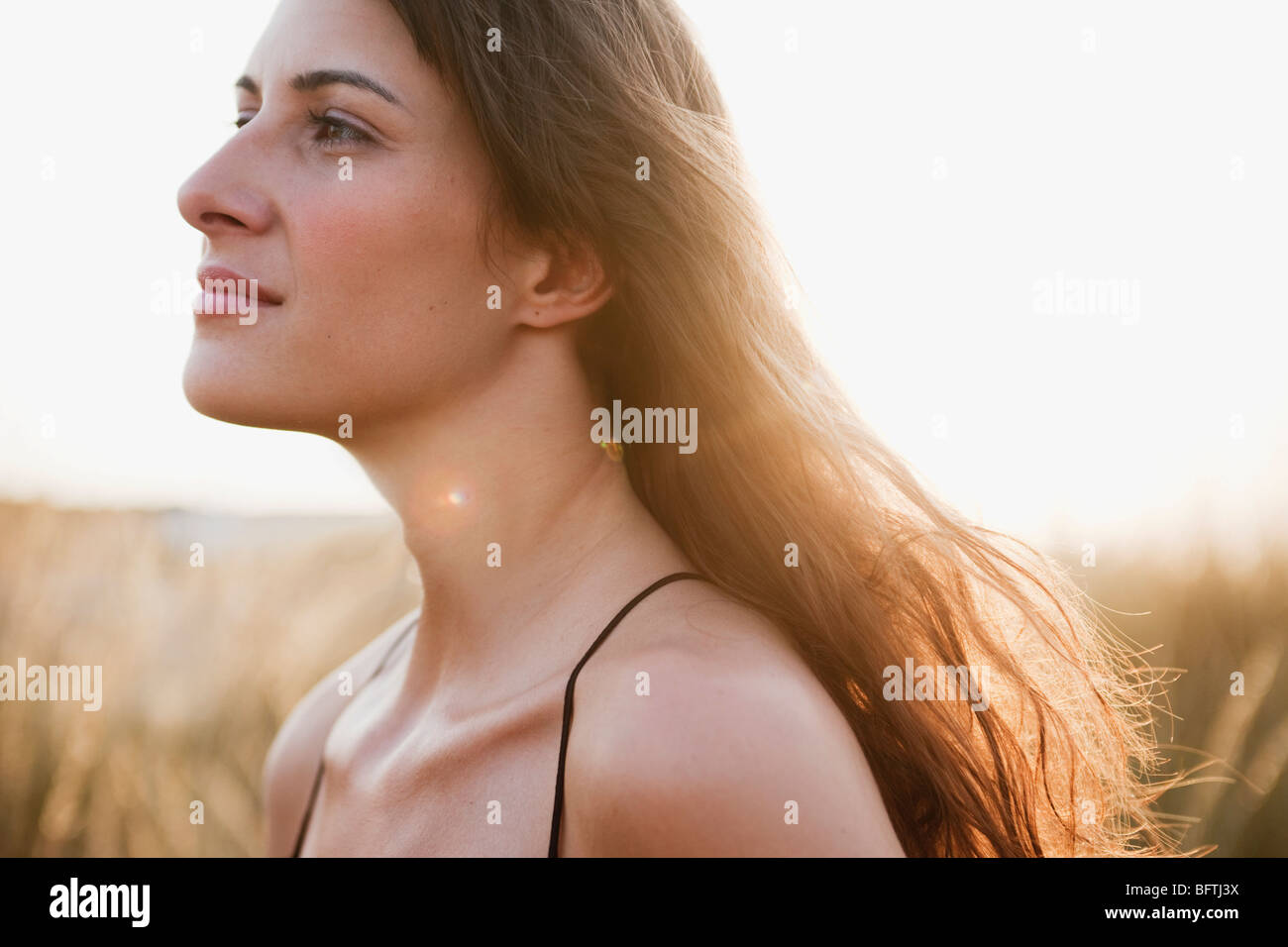 woman strolling through reed Stock Photo