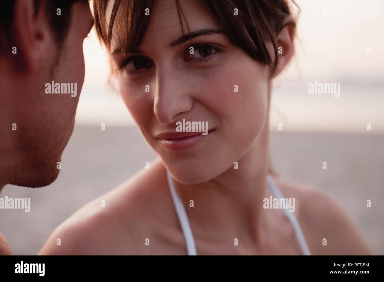 woman next to a man looking at viewer Stock Photo