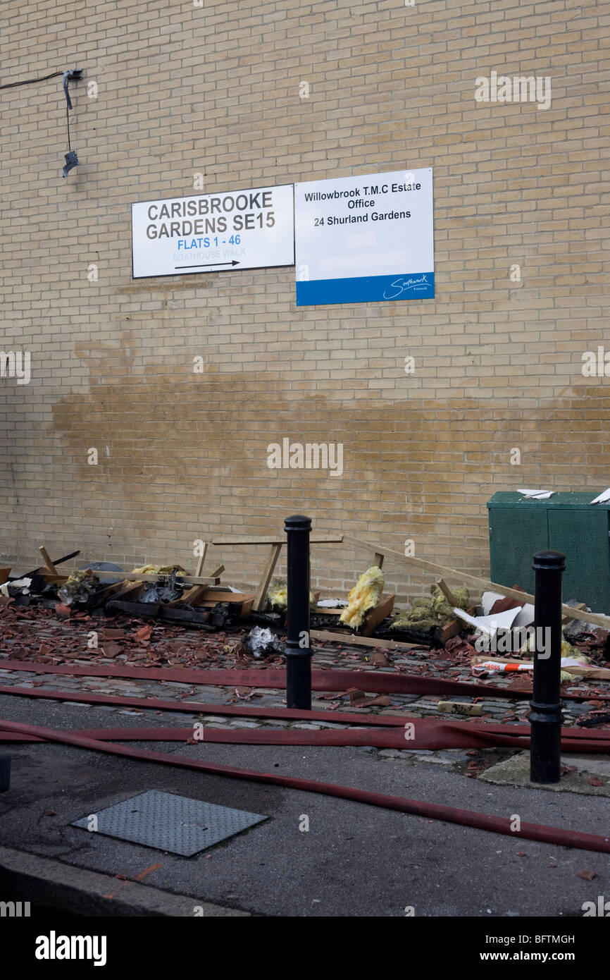 Roofing debris lies on the pavements from nearby flats after an inner-city fire in London. Stock Photo