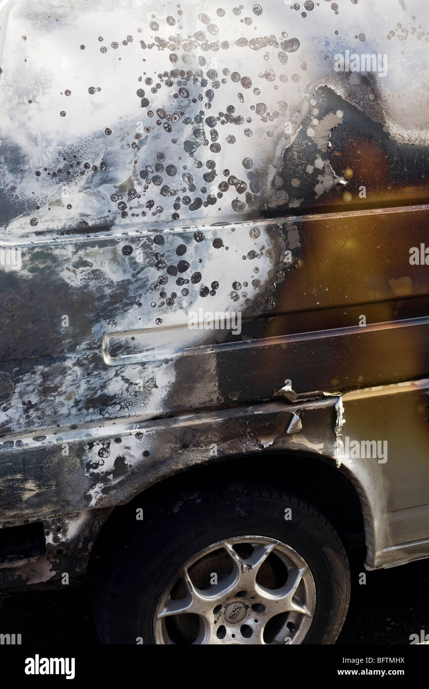 Scorched paintwork of a van after an inner-city estate fire in south London. Stock Photo
