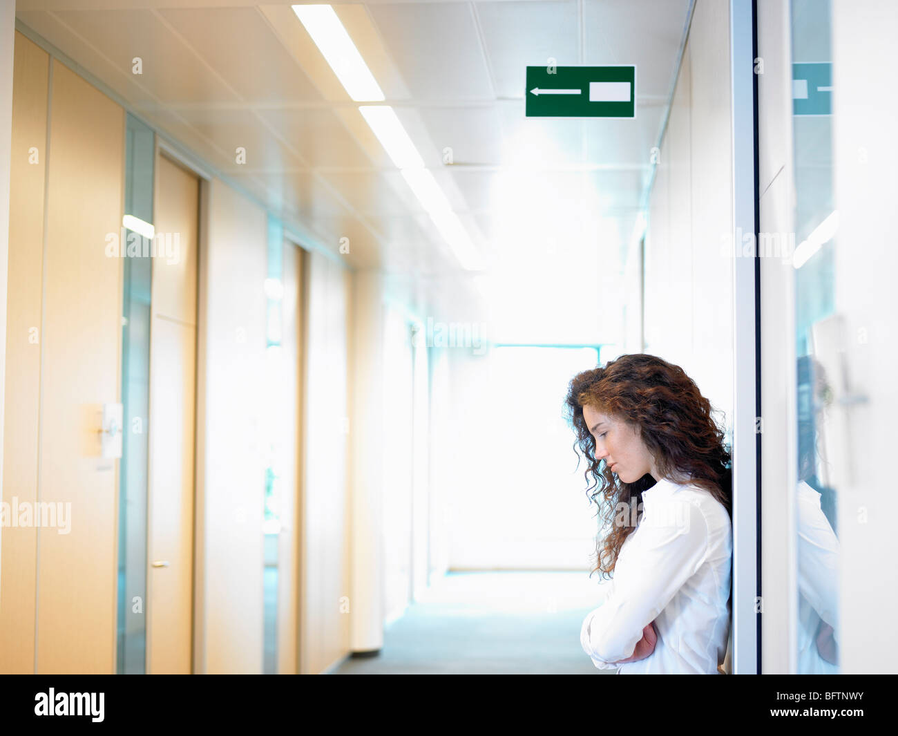 Business woman against the wall Stock Photo