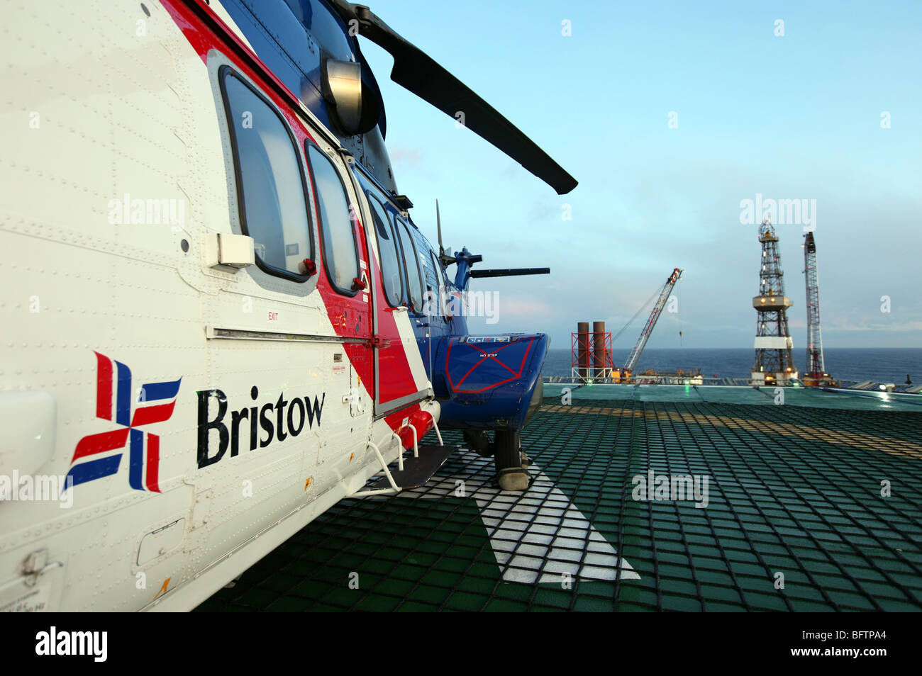 Bristow Superpuma EC 225 helicopter sitting on helipad on north sea oil platform off Scottish coast, UK Stock Photo