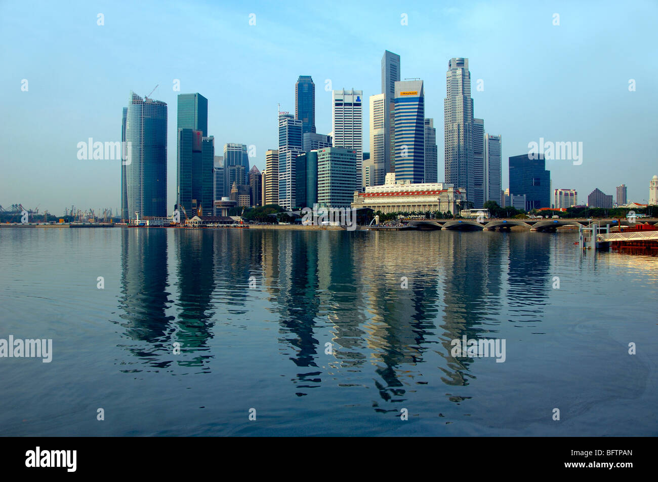 Skyline of Financial District with Reflected Office Tower Blocks or Skyscrapers Across Singapore Harbour or Harbor, Singapour Stock Photo