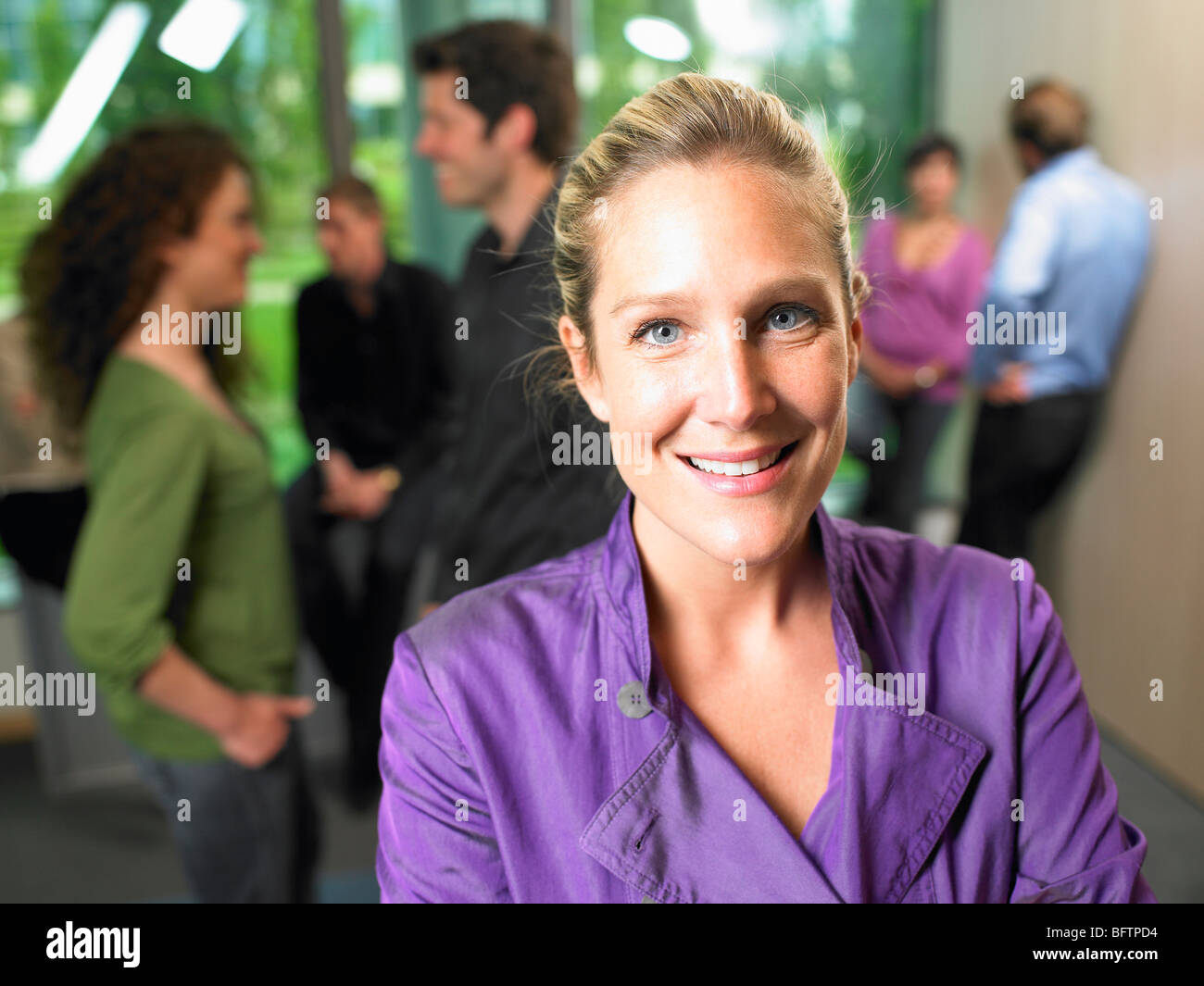 Happy business woman smiling standing hi-res stock photography and ...
