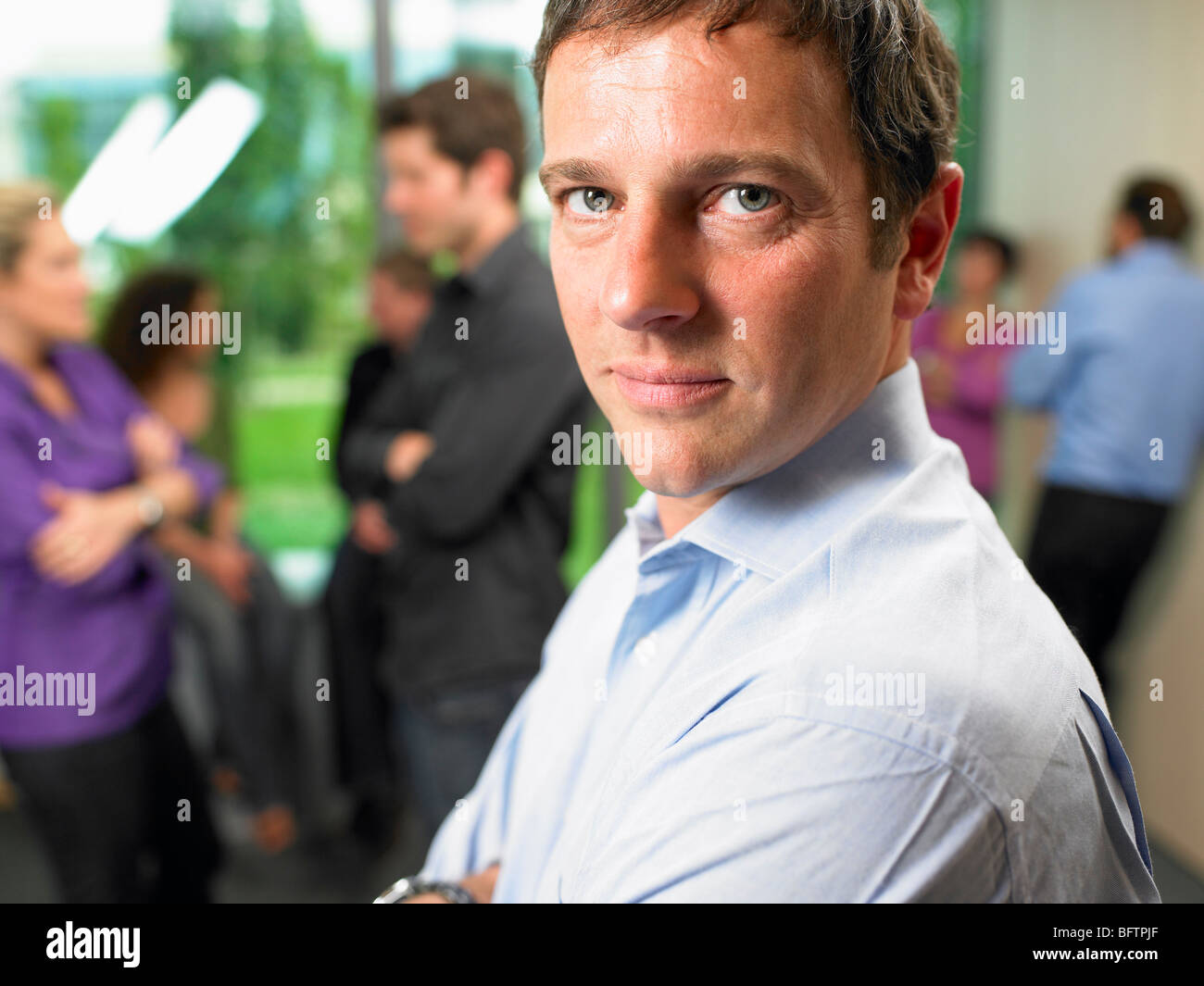 Business man in the office, smiling Stock Photo - Alamy