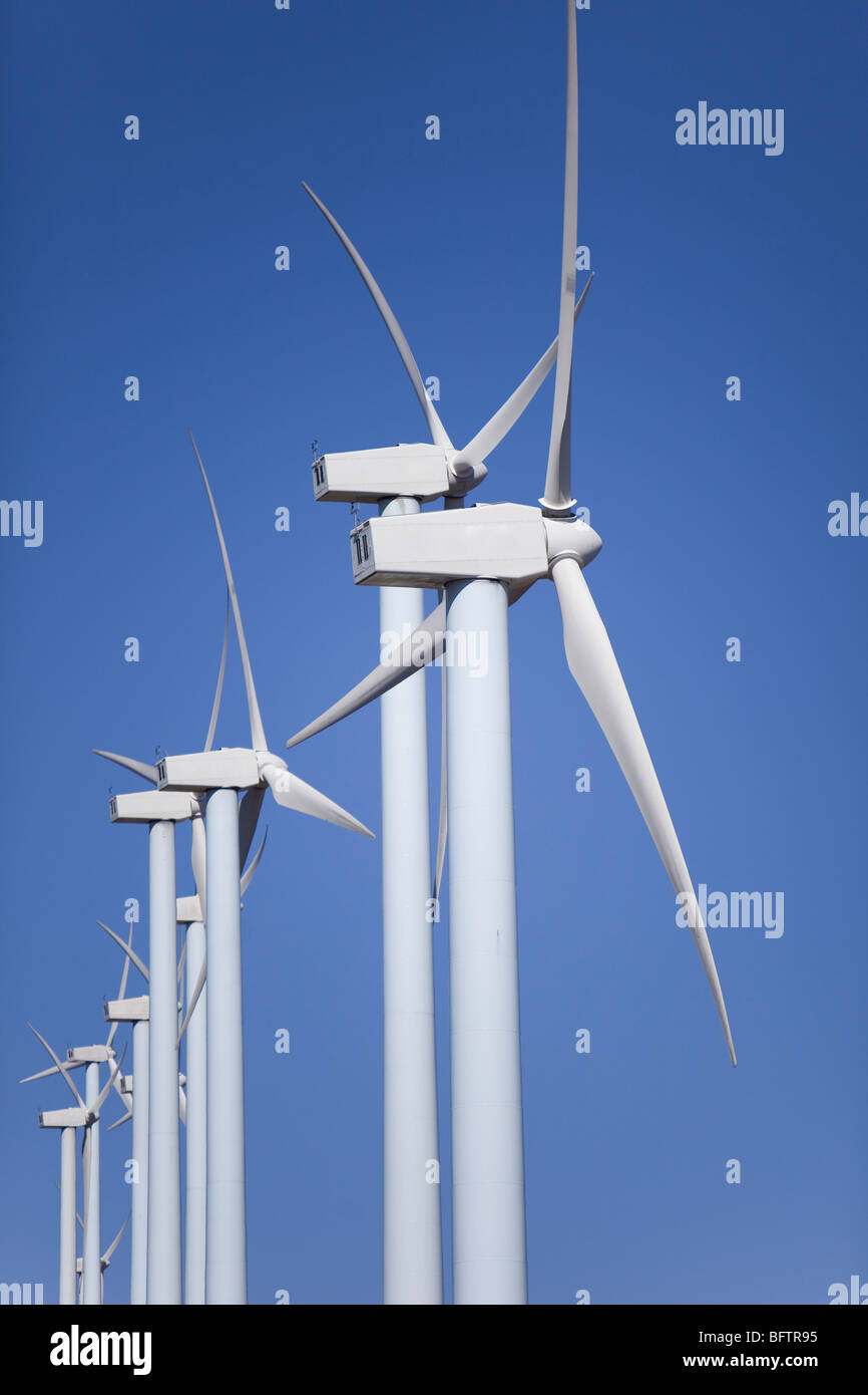 wind turbines renewable power over a blue sky Stock Photo