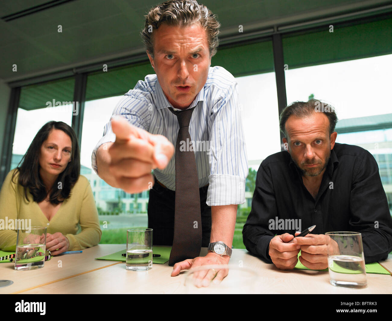 Business man angry with coworker Stock Photo