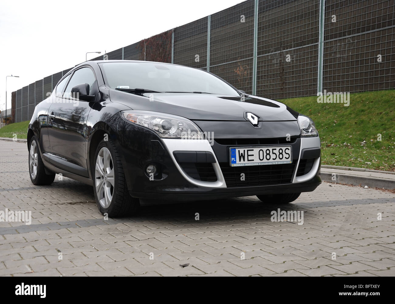 Renault Megane III Coupe 2.0 TCE - 2009 - black metallic - two doors (2D) -  French compact coupe - on a car park Stock Photo - Alamy