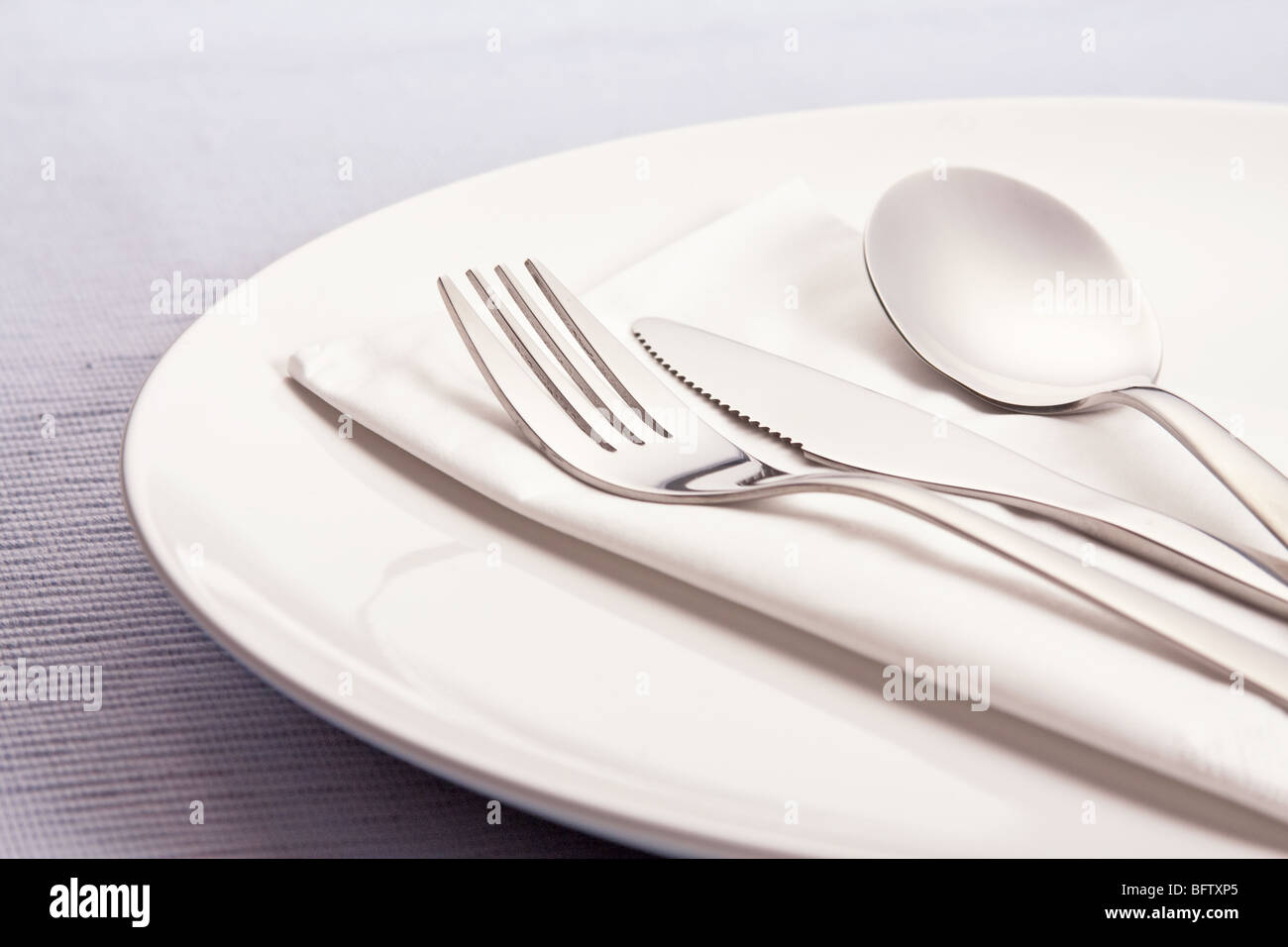 silverware on plate Stock Photo Alamy