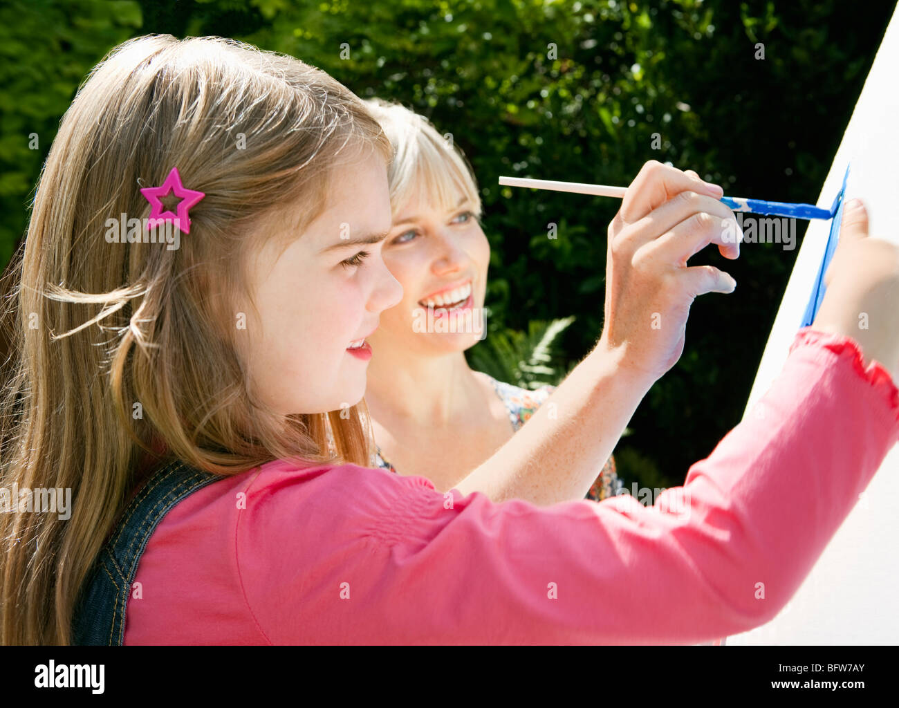 Mother And Daughter Painting Together Stock Photo Alamy