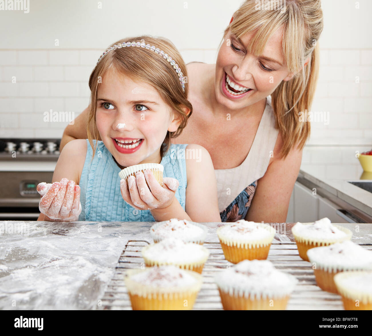 Mum and daughter with cakes Stock Photo