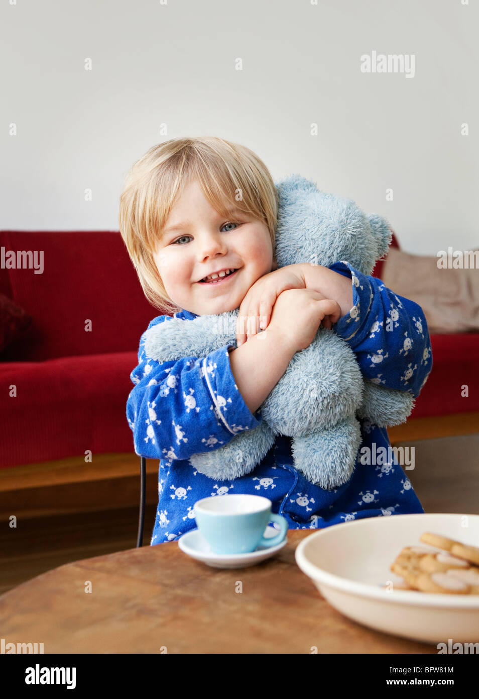 A boy toddler cuddling his teddy bear Stock Photo Alamy