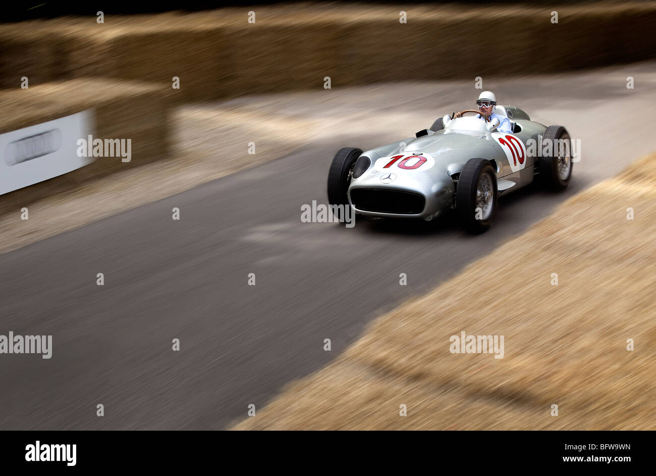 Mercedes W154 GP racing car at speed at Goodwood Festival driven by Sir Stirling Moss Stock Photo