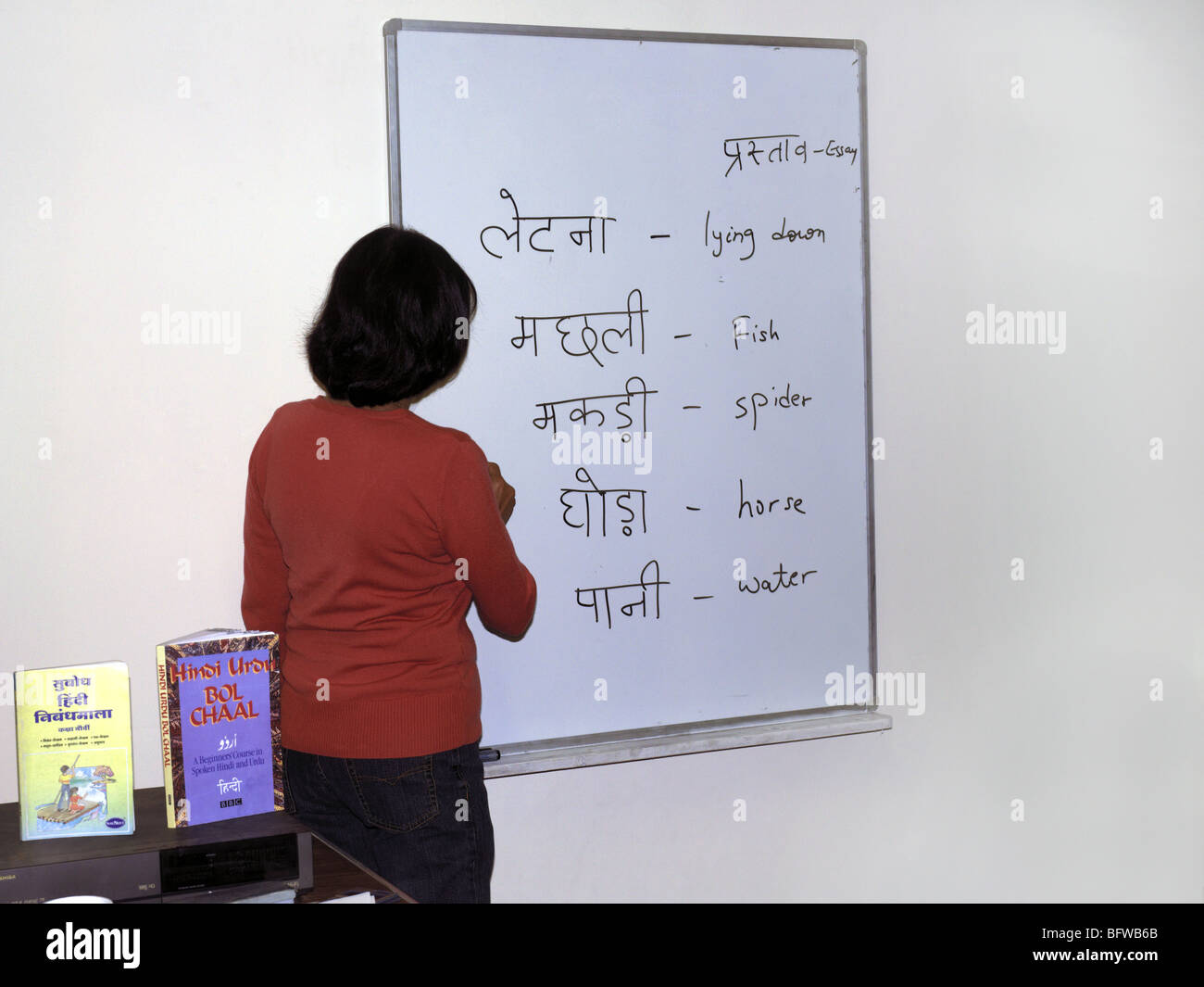 Teacher writing on White Board Hindu School Wimbledon Stock Photo