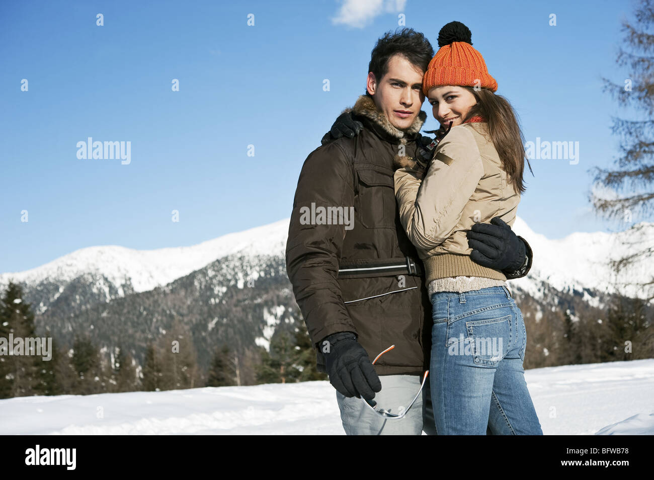 Couple embracing in winter scene Stock Photo - Alamy