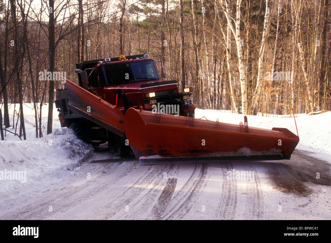 Snow plough working in New England Stock Photo Alamy