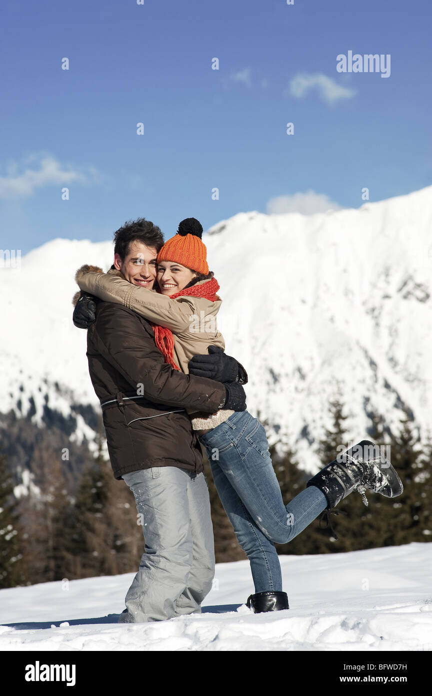 Couple embracing in winter scene Stock Photo - Alamy