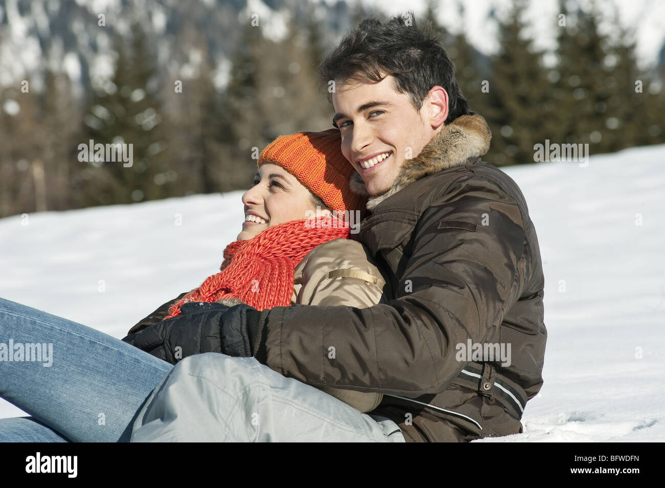 Couple embracing in winter scene Stock Photo - Alamy