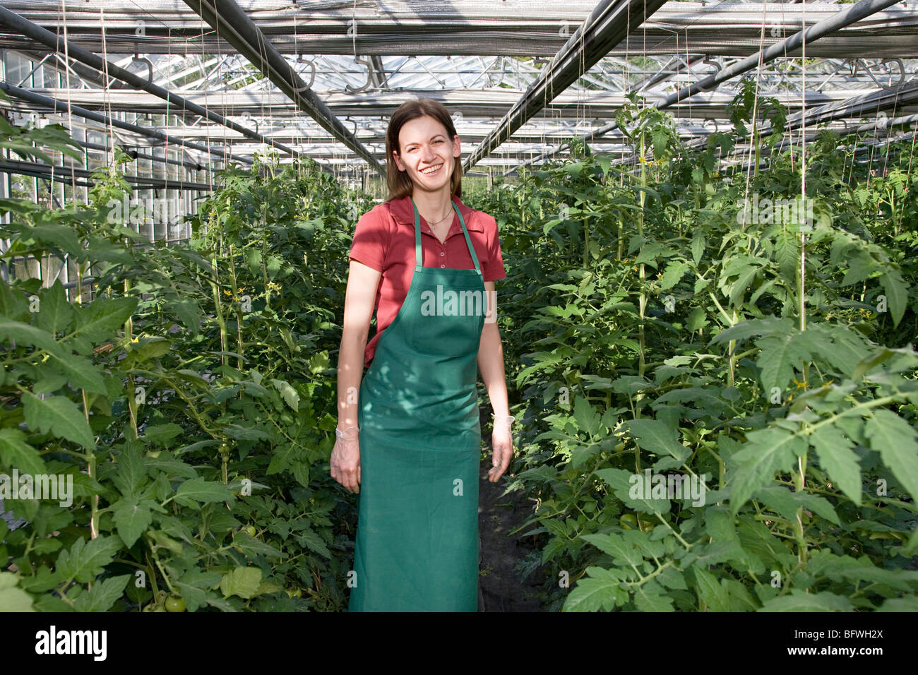 woman in greenhouse Stock Photo - Alamy