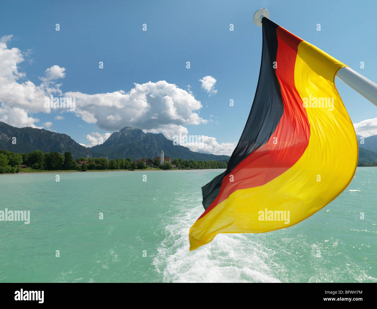 German national flag flying from pole Stock Photo