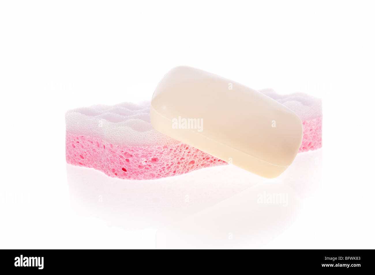 Bath sponge and a soap bar isolated on a white background Stock Photo
