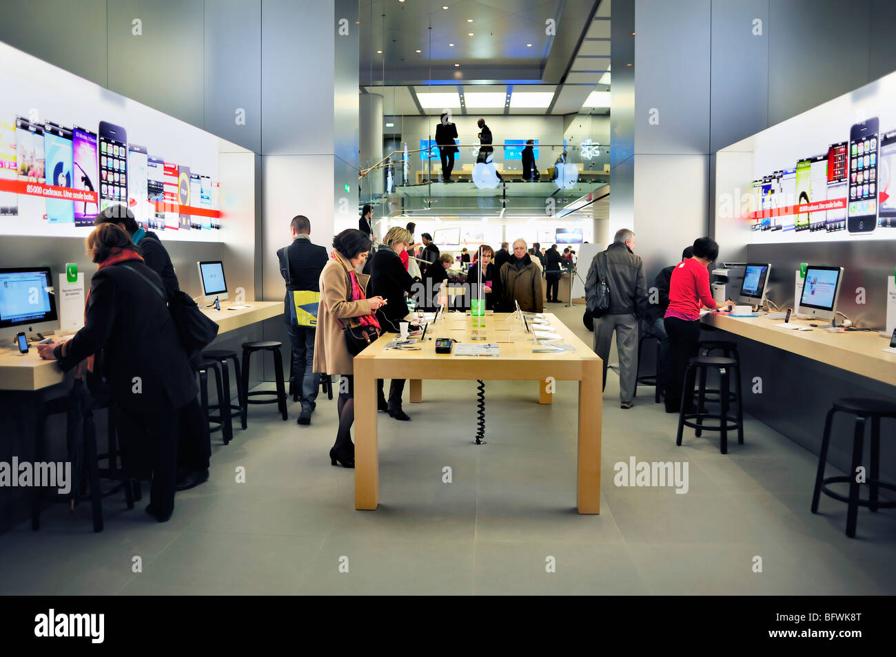 An Apple Store with People Waiting To Purchase Apple Macbooks, IPads and  IPhones Editorial Image - Image of designs, ecosystem: 168250490