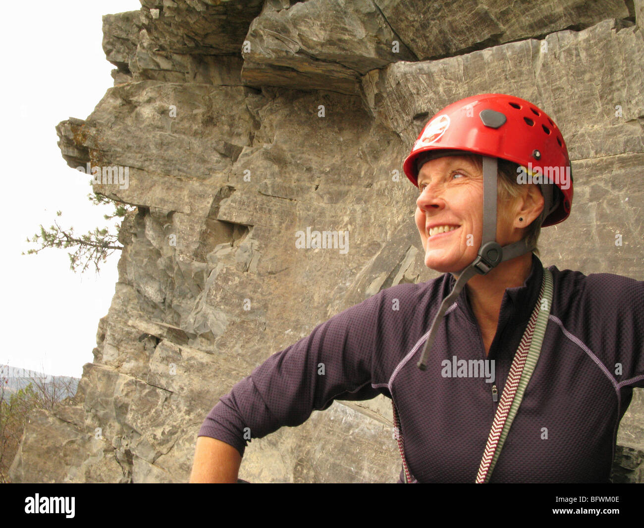 mature woman preparing to mountain climb Stock Photo