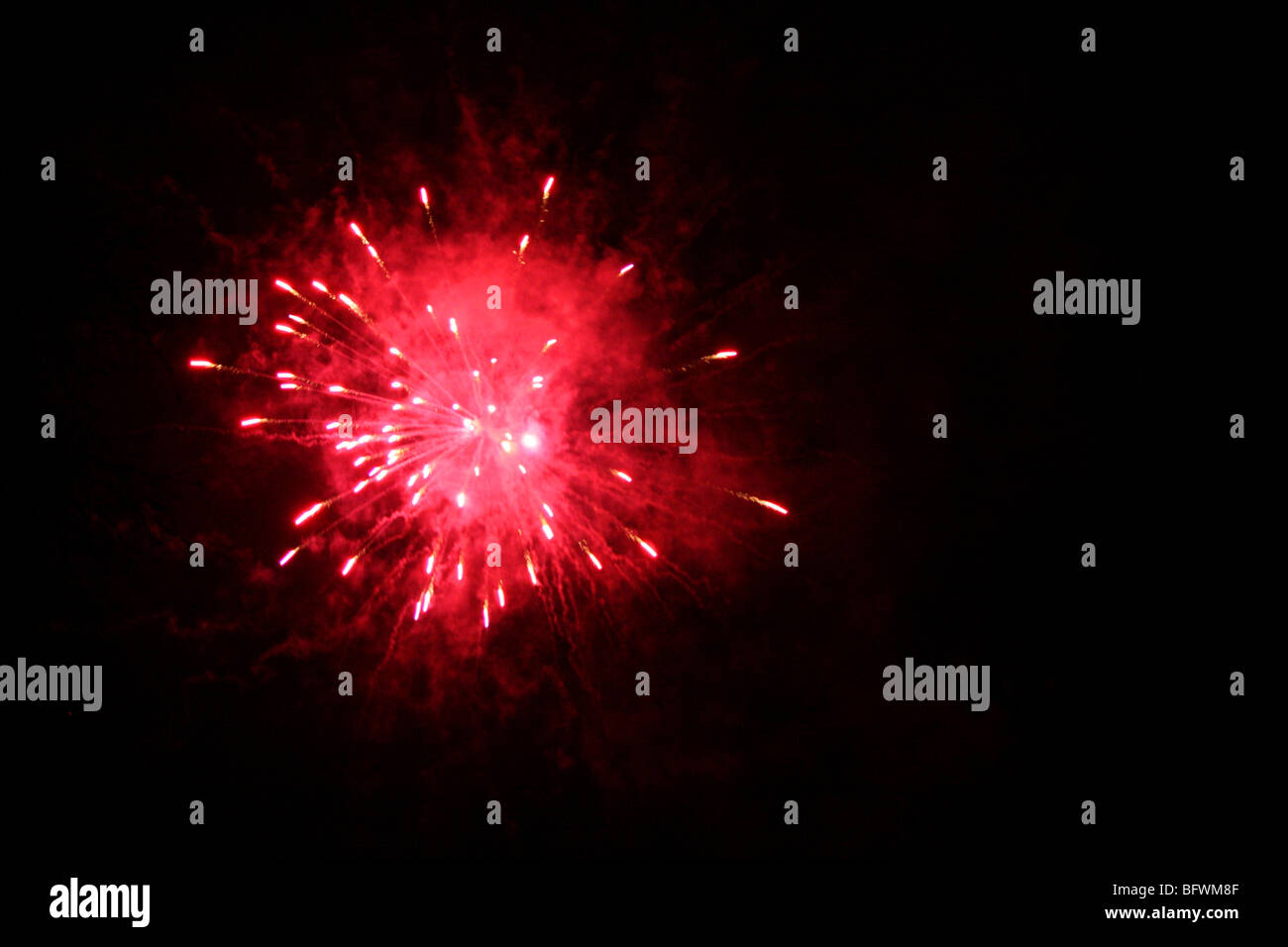 firecrackers exploding on new years eve Stock Photo