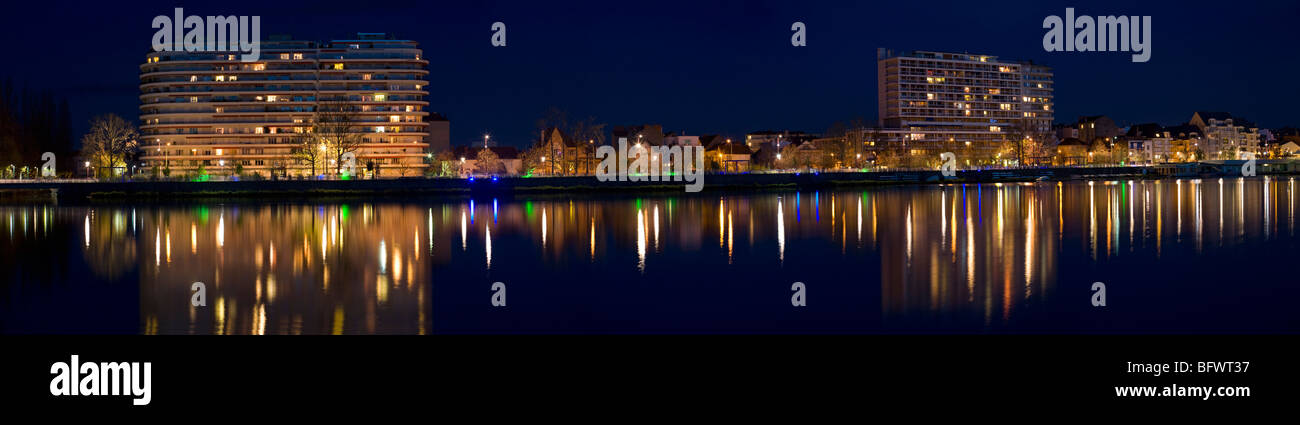 By night, a panoramic view of residential blocks alongside the Allier Lake (Vichy - Auvergne - France). Stock Photo