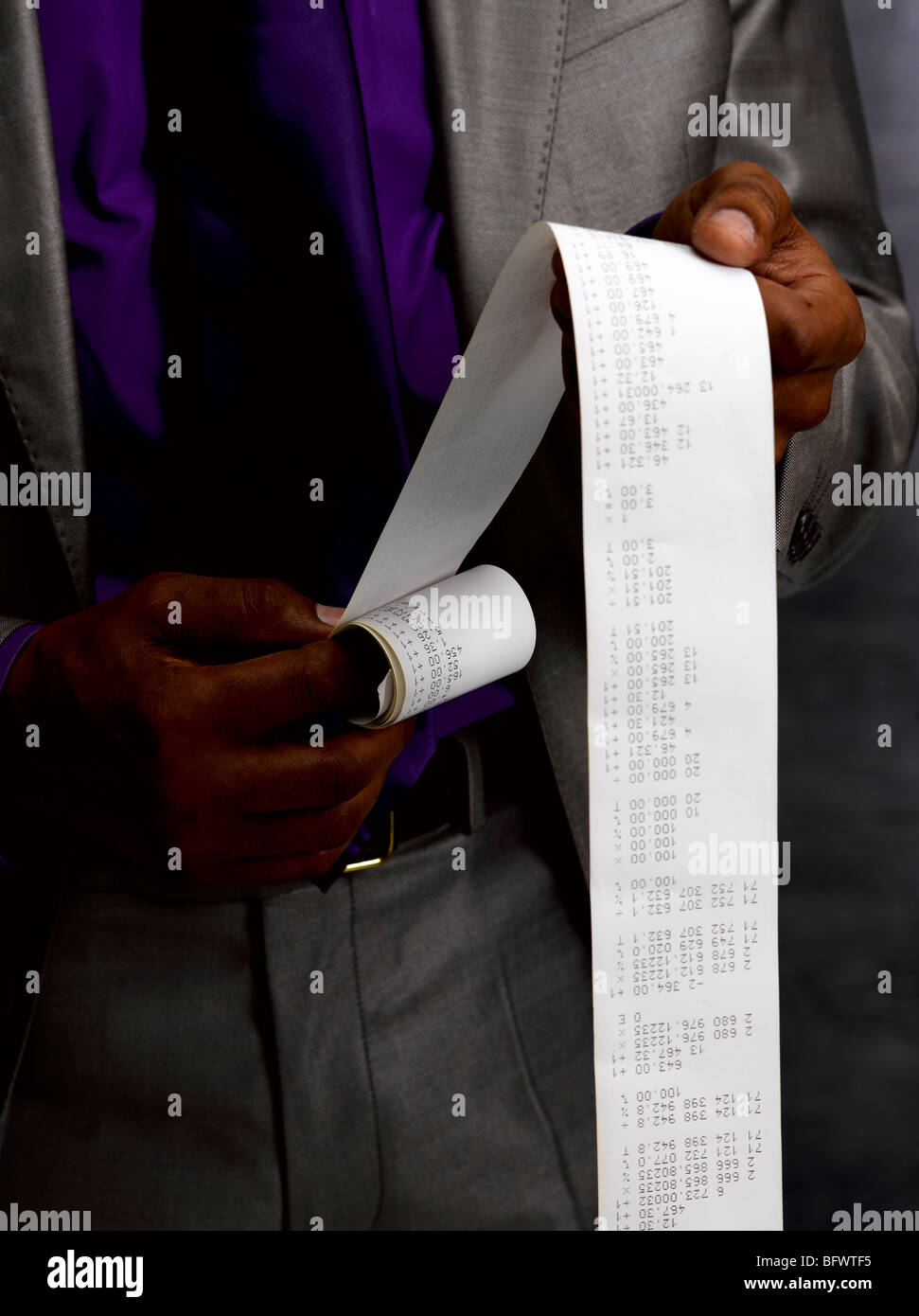 Business man with long paper receipt Stock Photo