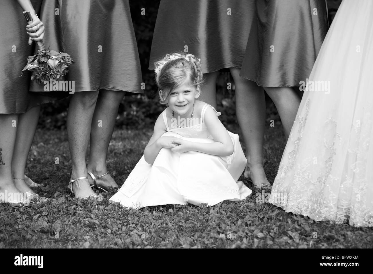 5 10 years crouch female flower girl happy hires stock photography and