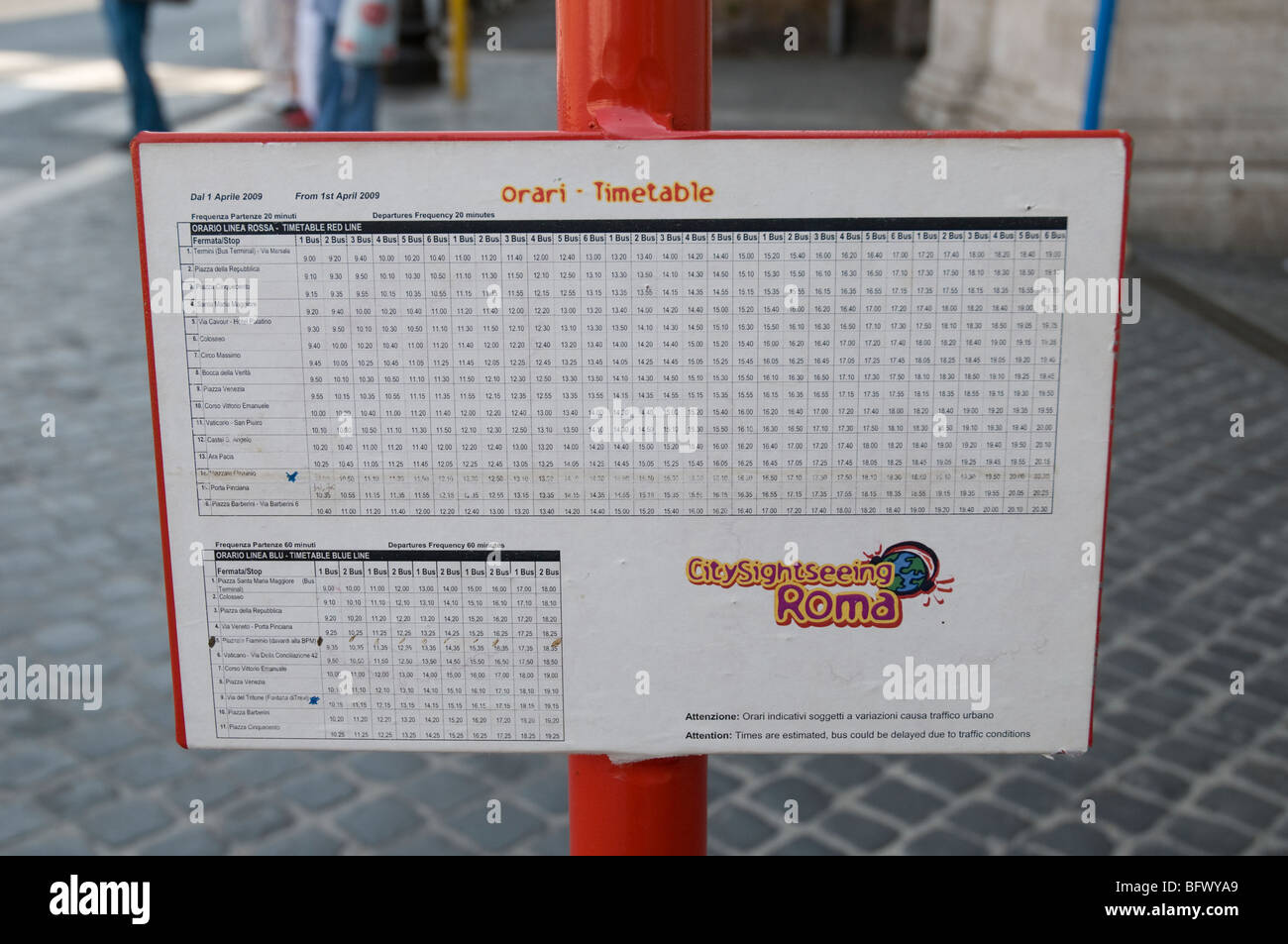 Road sign with timetable of Roman buses. Stock Photo