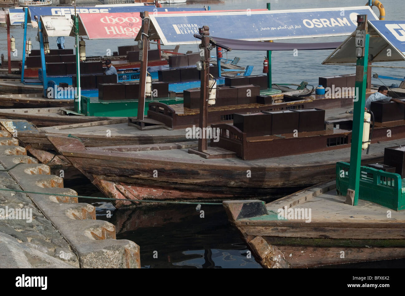 Traditional Abra boats docked on the Dubai Creek, Dubai Stock Photo