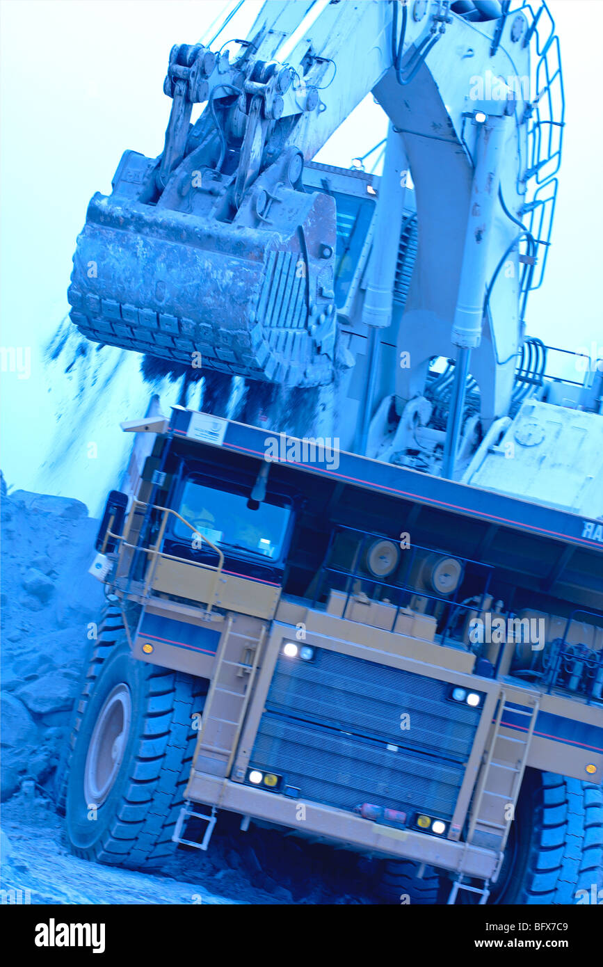 Loading ore in an open pit mine in, Ghana, Africa Stock Photo
