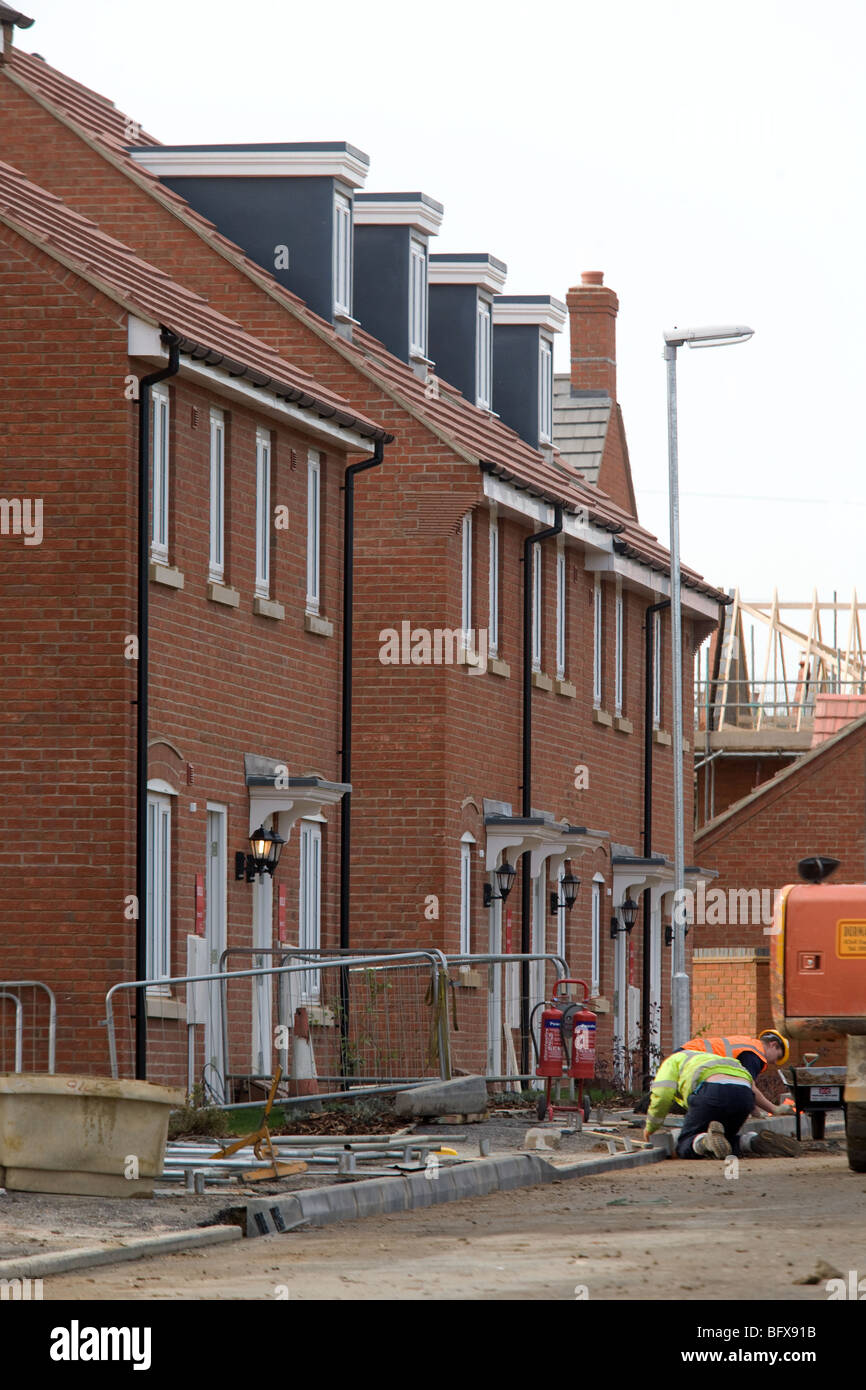 Workers work on a new housing development Stock Photo Alamy