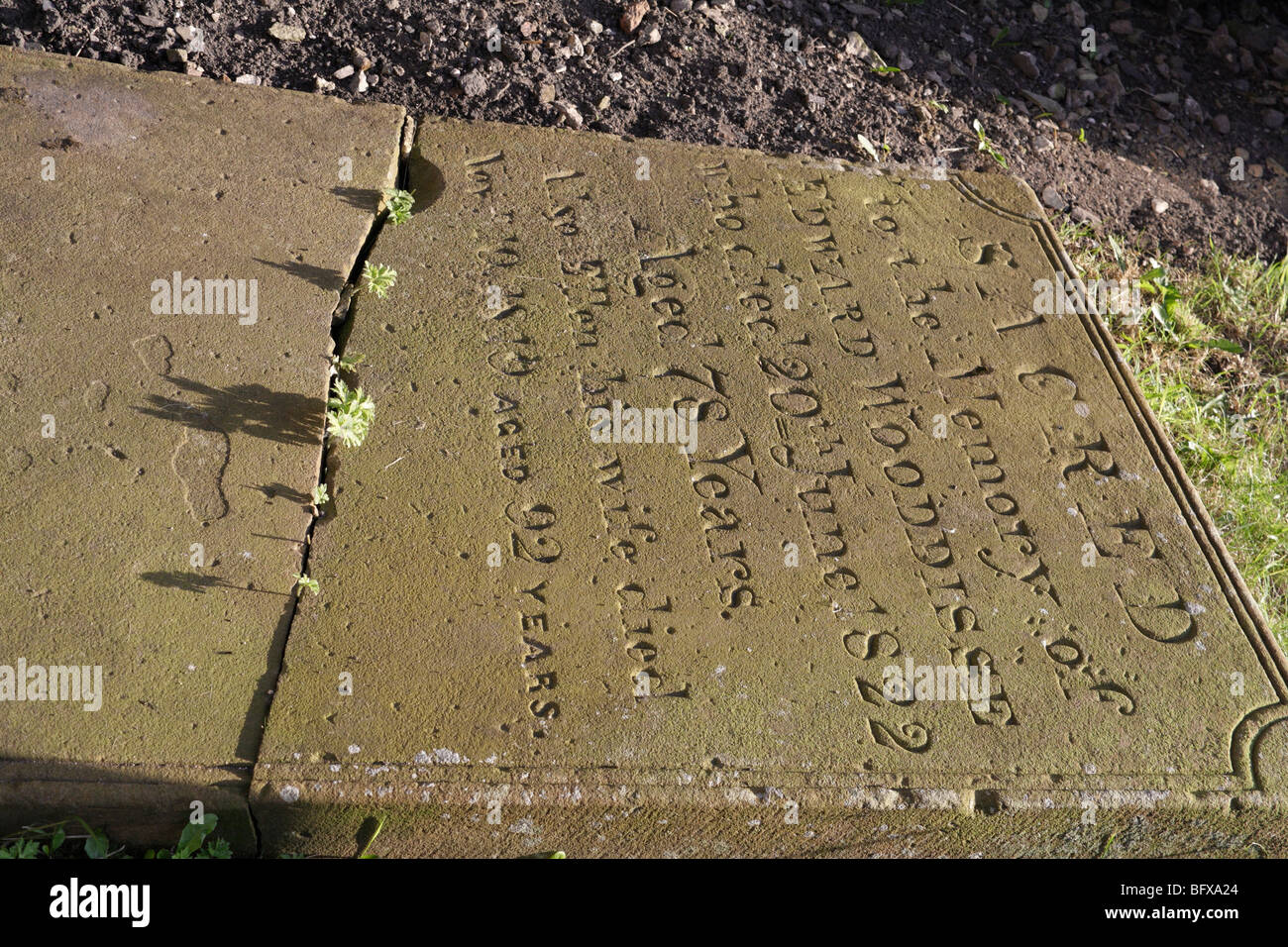 Broken Memorial Stone in St Giles church in Hartington in Derbyshire Stock Photo