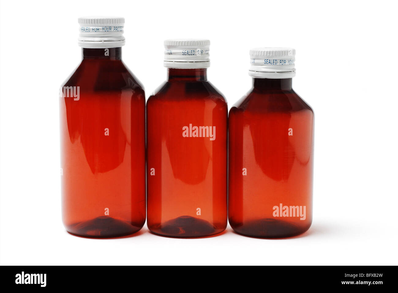Three sealed medicine bottles on white background Stock Photo Alamy