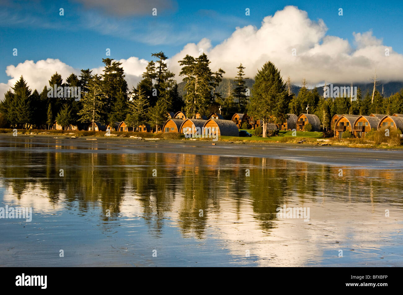 Ocean Village Beach Resort reflected in wet sand of MacKenzie Beach,  Tofino, BC British Columbia, Canada Stock Photo - Alamy