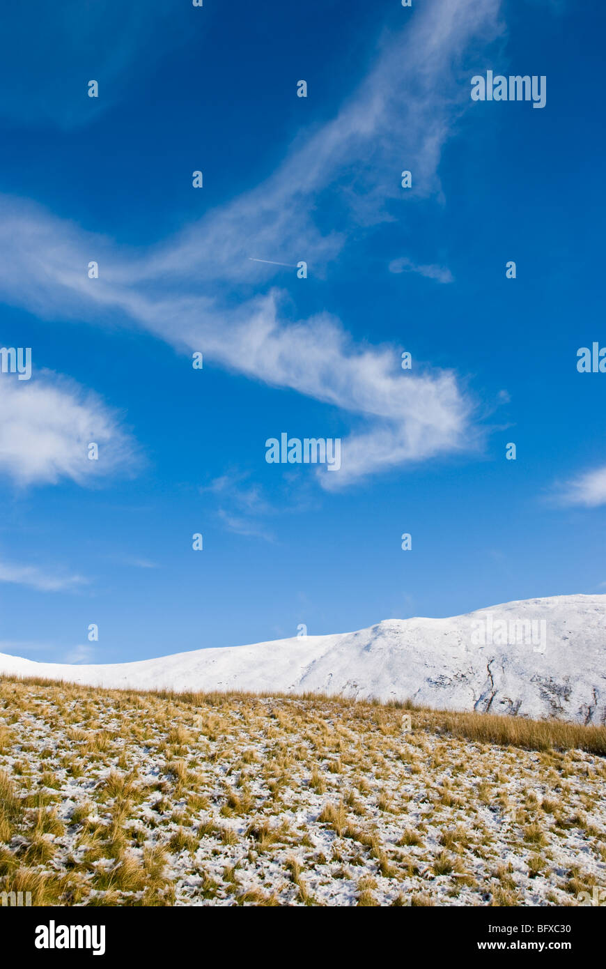 Blue skies and snow on the Lake District fells Stock Photo