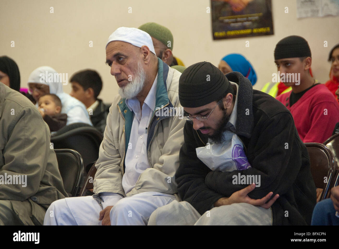 Men in audience at Eid Milad-Un-Nabi Celebrations at Sunni Muslim Association, Tooting, London. Stock Photo