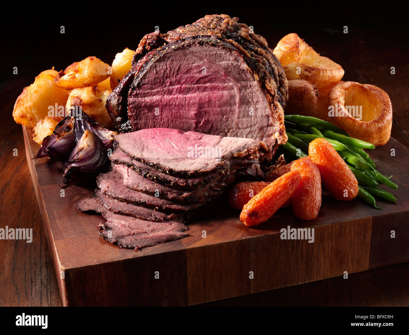 Irish roast beef joint with garlic Stock Photo Alamy