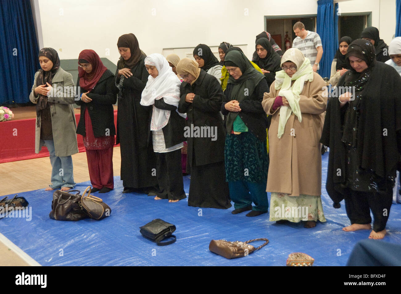 Women at prayers at Eid Milad-Un-Nabi Celebrations at Sunni Muslim Association, Tooting, London. Stock Photo