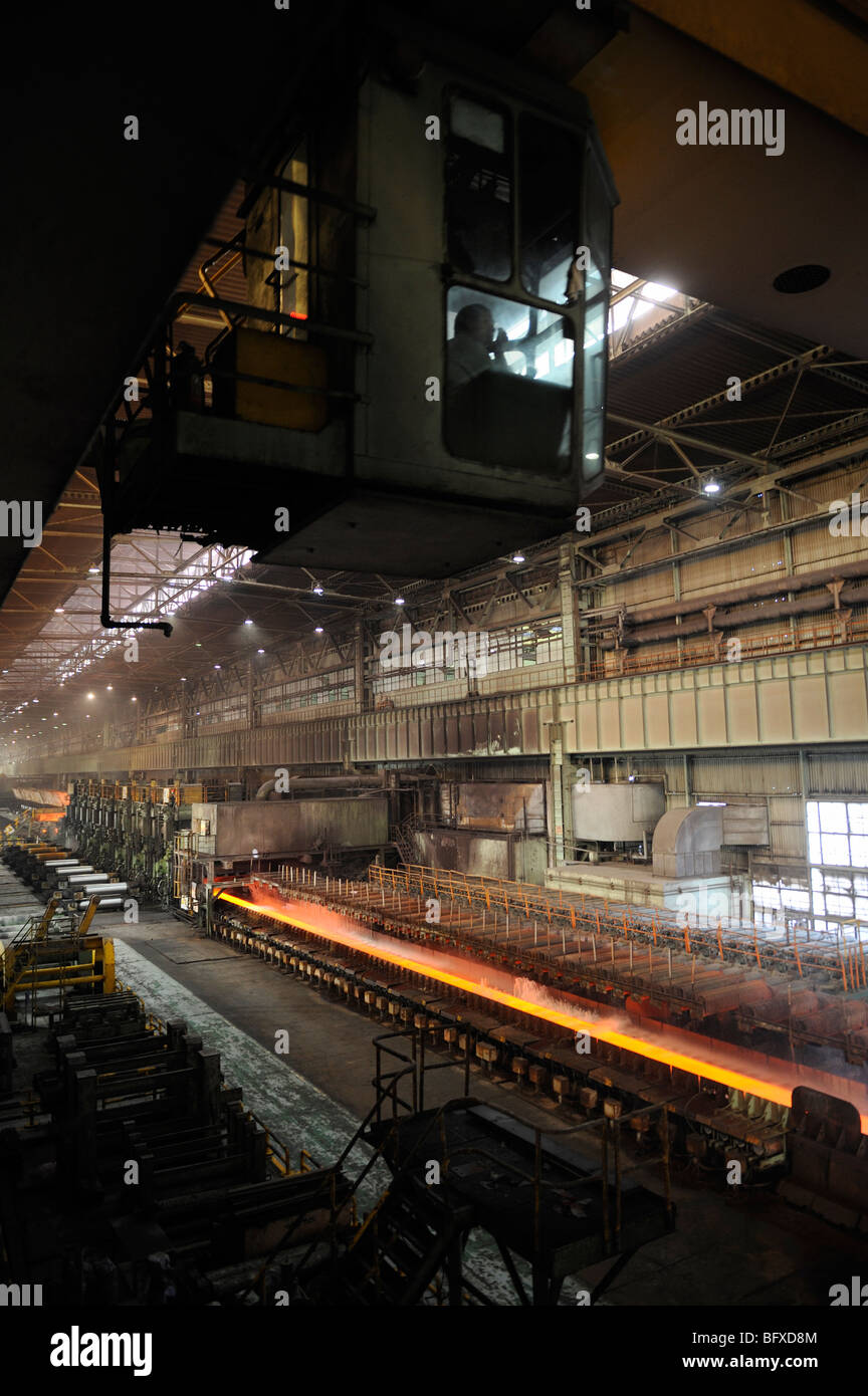 Molten hot plate steel being rolled at Shanghai Baosteel factory. 20-Oct-2009 Stock Photo