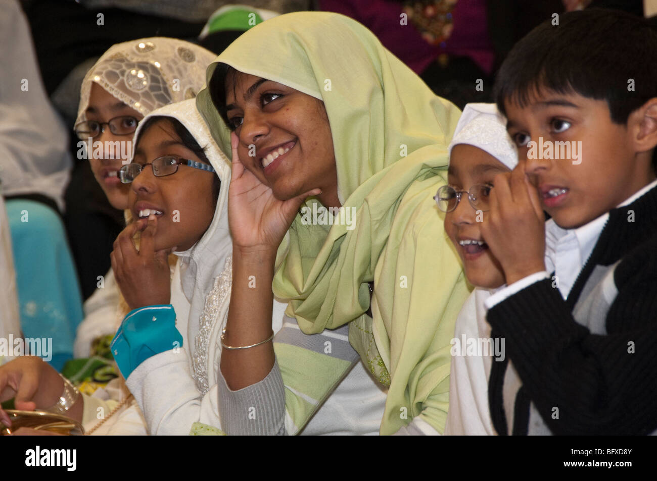 Women and children watch talent show at Eid Milad-Un-Nabi Celebrations at Sunni Muslim Association, Tooting, London. Stock Photo