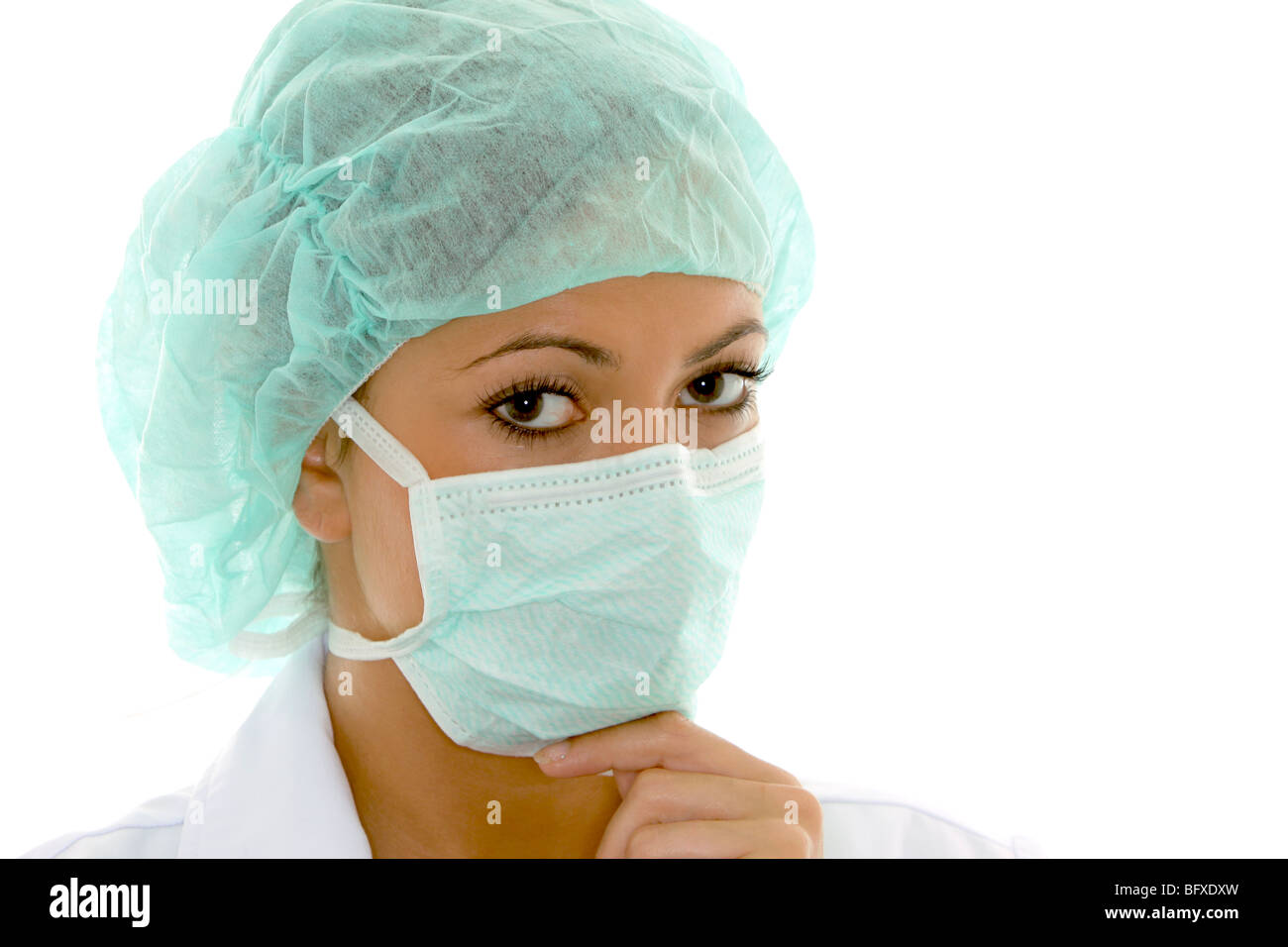 Ärztin mit Mundschutz und Schutzhaube, female doctor with surgical mask Stock Photo